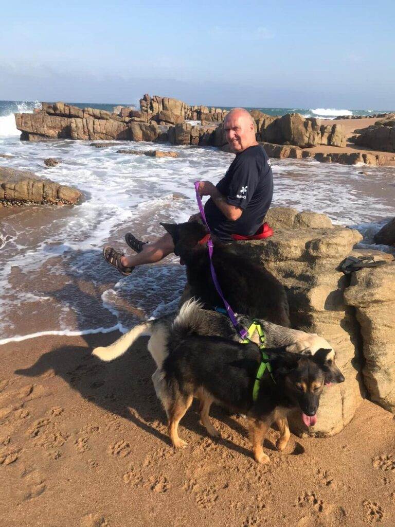 a young boy training his dog garry and his puppies relaxing